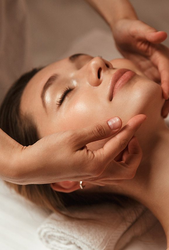 Woman getting facial massage