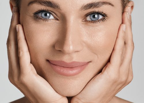 Woman with great skin after aesthetic facial treatments