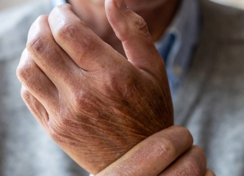 Man dealing with chronic pain in his wrist