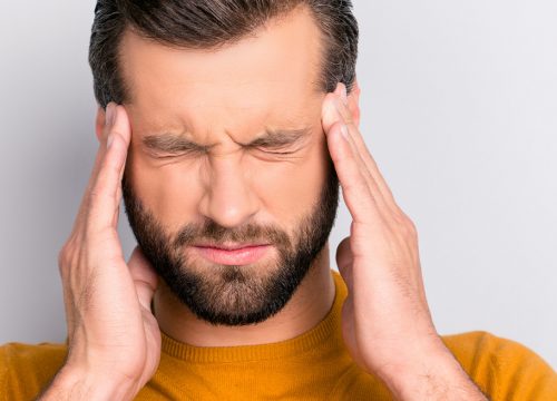 Man dealing with frequent headaches