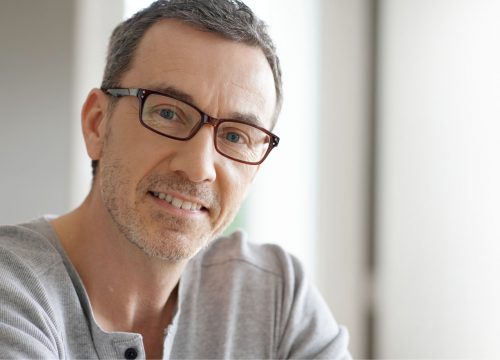 Smiling, healthy man with glasses