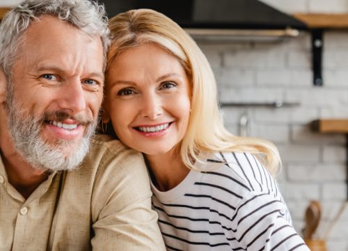 Photo of a healthy older couple sitting in their kitchen