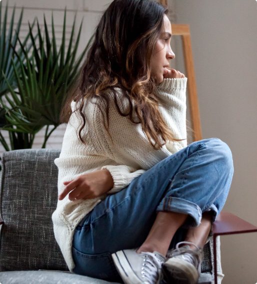 Woman with anxiety sitting in a chair