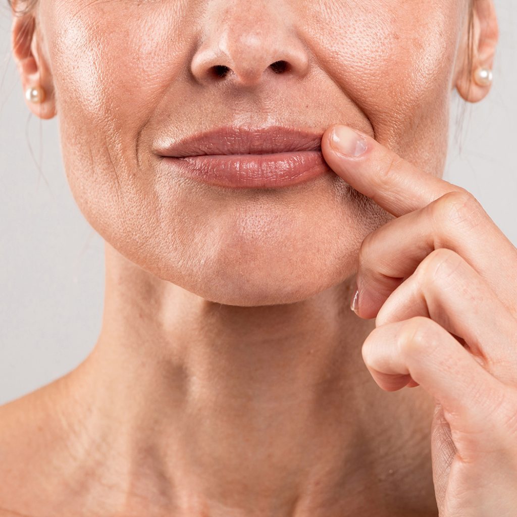 Woman touching her lip