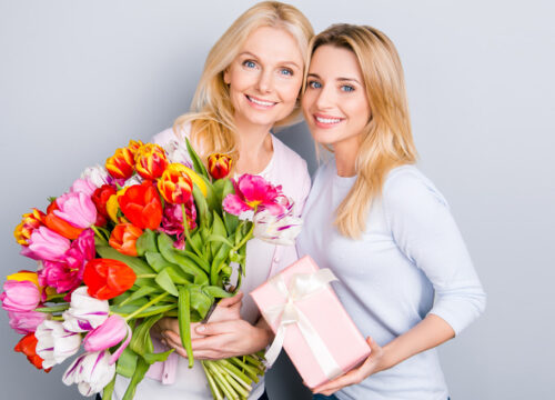 Mother receiving a gift of skincare products from her daughter for Mother's Day